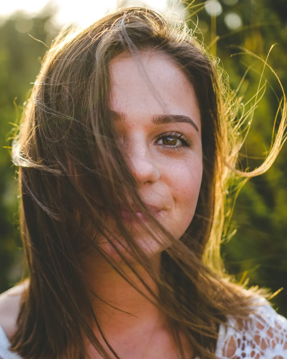 An outdoor portrait surrounded by greenery
